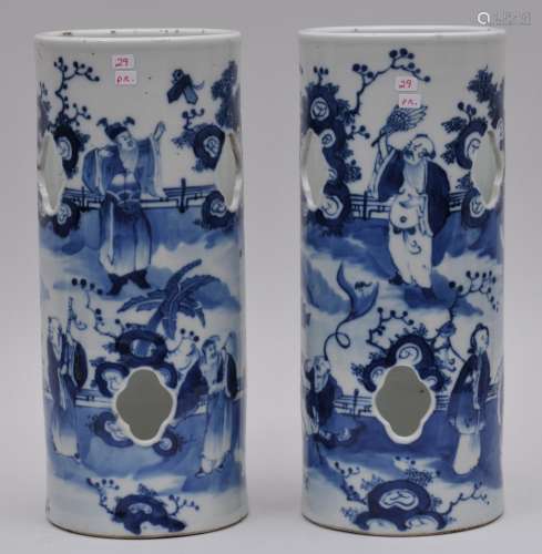 Pair of porcelain hat stands. China. 19th century. Cylindrical form with pierced sides. Underglaze blue decoration of the Immortals. 11-3/4