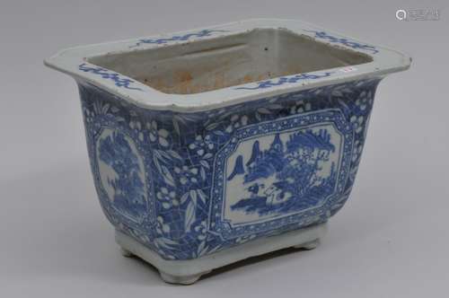 Porcelain planter. 19th century. Rectangular form. Underglaze blue decoration of landscape reserves on a bamboo, prunus and cracked ground.     9-1/2