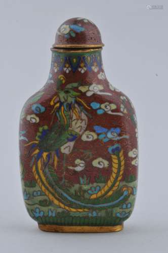 Cloisonne Snuff bottle. China. 19th century. Decoration of a phoenix on a red ground. 2-1/2