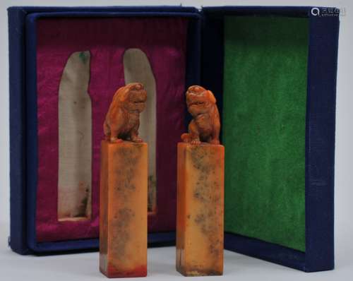 Boxed pair of soapstone seals. China. 19th century to early 20th century. Orange yellow stone. Foo dogs finials. Seals intact. 3