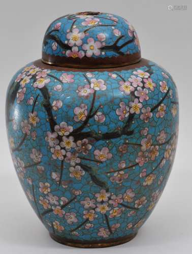 Cloisonne covered jar. Japan. Early 20th century. Oviform shape. Decoration of flowering prunus on a turquoise  cracked ice ground. Ta Ming mark on the base. Drilled for a lamp. 11-3/4