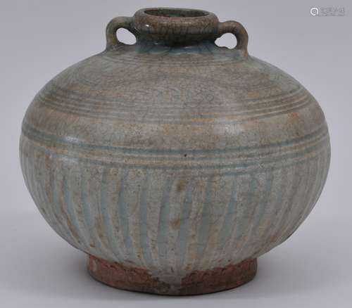 Stoneware jar. Thailand 13th century. Awankkalok ware. Globular form with two handles. Engraved floral scrolling and ribs beneath a blue green celadon glaze. 7