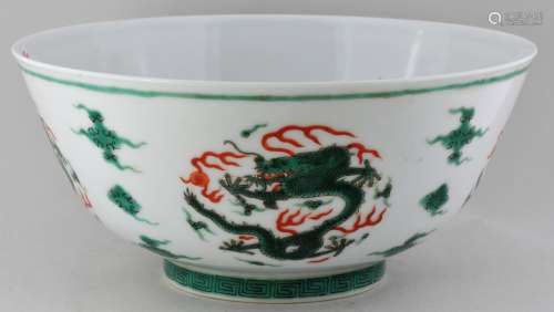Porcelain bowl. China. Late 19th century. Decoration of roundels of dragons in green and red with clouds. Ch'ia Ch'ing mark in underglaze blue on the base. 6-3/4