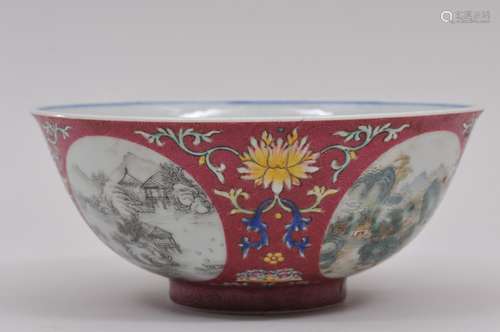 Porcelain bowl. China. Late 19th century. Underglaze blue floral interior. Exterior with reserves of landscapes in sepia on a magenta scraffetto ground and floral scrolling. 5-3/4