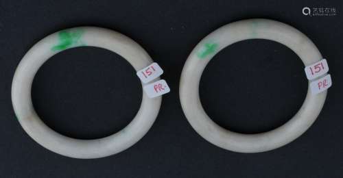 Pair of Jade bracelets. China. Chicken bone colour with bright apple green markings. 5