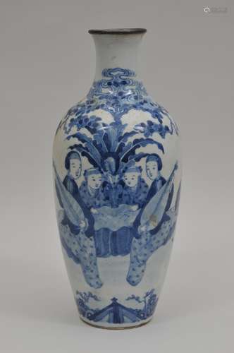 Porcelain vase. China. 19th century. Underglaze blue decoration of two women playing lutes and two children in a garden setting. K'ang Hsi mark. 14