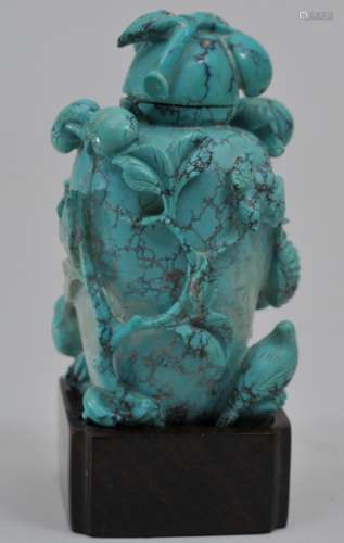 Snuff bottle. China. 19th century. Turquoise carved in high relief with birds, flowers and fruit. 2-1/8