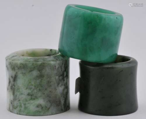 3 Archers rings. Two of green jade, one of green glass.   From the Estate of Jeanette Curuby.
