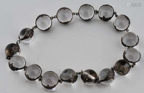 Rock crystal and silver necklace. Japan. Meiji period (1868-1912). Crystal spheres with mountings of silver flowers.