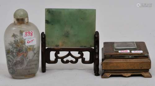 Lot of three items. To include: An interior painted snuff bottle, a bright green jadeite rectangular plaque and a small engraved brass plaque.