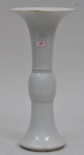 Porcelain beaker vase. China. 19th century. Ku form. Moon white glaze. 9-3/4