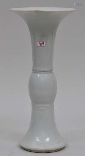 Porcelain beaker vase. China. 19th century. Ku form. Moon white glaze. 9-3/4