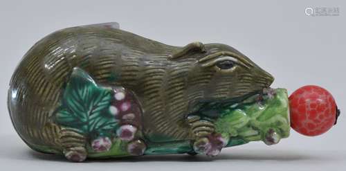 Snuff bottle. China. Early 20th century. Porcelain moulded as a squirrel with flowers. 2-3/8