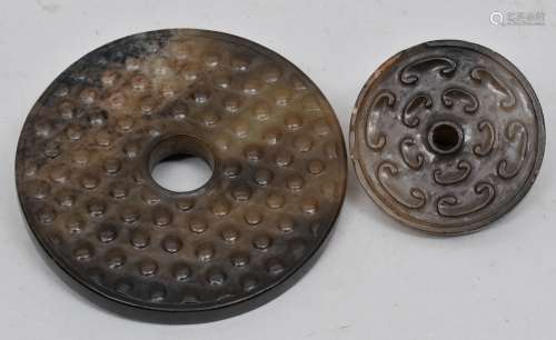 Lot of two Archaic style Jades. China. 20th century .Grey white calcified stone. A Pi dish and a Huang pendant. 4-1/4