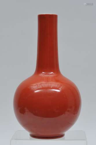 Porcelain vase. China. 19th to early 20th century. Bottle form. Coral red glaze. Ch'ien Lung mark on the base. 12