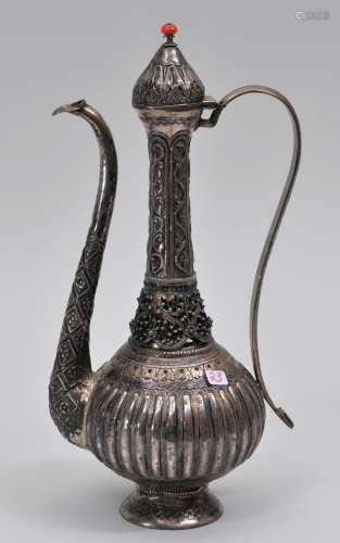 Silver ewer. Ottoman. 19th century. Repousse with filigree set with coral. Repairs to neck and foot. 10-1/4