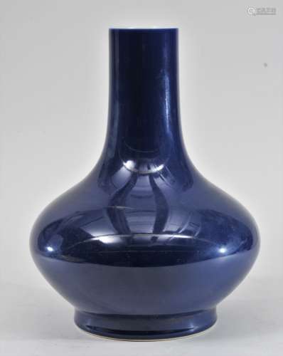 Porcelain vase. China. 20th century. Bottle form. Dark cobalt blue monochrome. Ch'ien Lung mark. 12-1/2