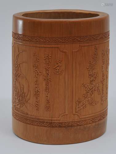 Bamboo brush pot. China. 20th century. Surface carved with calligraphy and flowers. 6