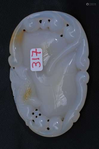 Agate pendant. China. 20th century. Pure white stone with a crystaline citrine area. Carving of a fish. 2-3/4