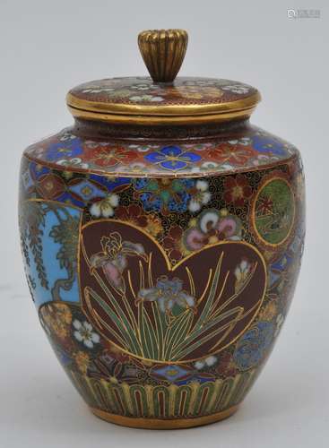 Cloisonné covered jar. Japan. Meiji period. (1868-1912). Tsuiki Jippo type. Reserves of flowers on a brocaded ground. 3-1/2