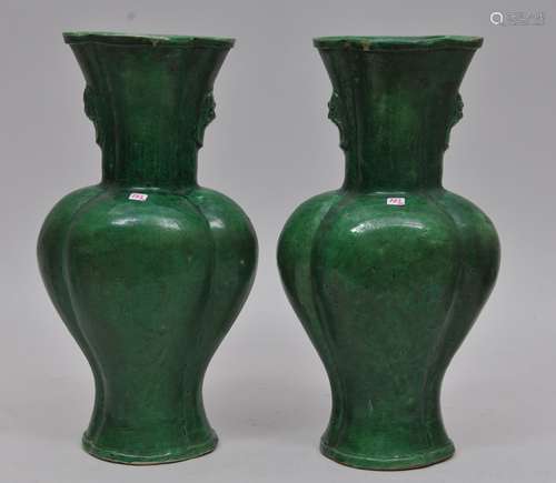 Pair of pottery vase. China. 19th century. Lobated bodies with lion mask handles. Forrest green glaze. 12-1/2