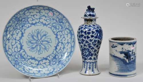 Lot of three porcelains. China. 19th century. To include: A covered jar, a plate with underglaze blue decoration of floral scrolling and a brush holder decorated with a landscape. Vase- 9