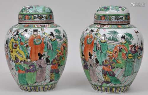 Pair of covered jars. China. 19th century. Famille Verte decoration of an historical scene. 11-1/2