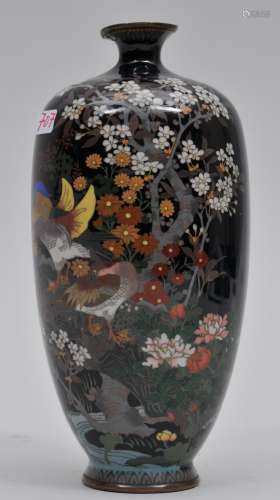 Cloisonné vase. Japan. Meiji period. (1868-1912). Decoration of a pair of mandarin ducks in a bed of flowers on a black ground. 6-1/2