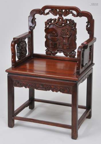 Rosewood  chair. China. 19th century. Surfaces carved with 