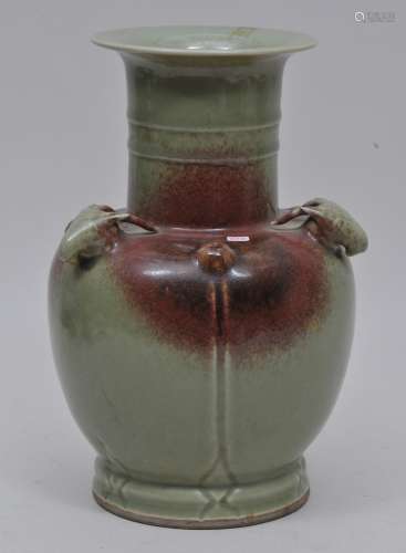 Porcelain vase. China. 19th century. Chun yao style glaze of green with red splashes. Three rams heads at the shoulders. 11-1/4