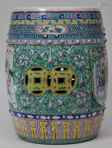 Porcelain garden seat. China. 19th century. Barrel shaped with pierced cash coins. Reserves of historical scenes with various floral and brocade borders. 19