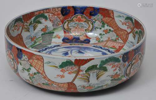 Large porcelain bowl. Japan. Meiji period (1868-1912). Imari ware. Decoration of landscape reserves with biscade patterns. 15