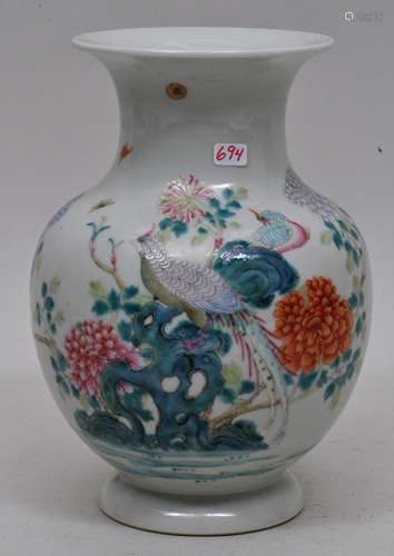 Porcelain vase. China. 19th century. Round body with flaring neck and foot. Famille rose decoration of birds and flowers. Ch'ien Lung mark. 7-1/2