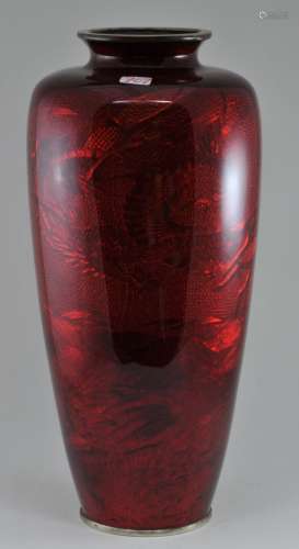 Enamel vase. Japan. Early 20th century. Bas Taille work with a dragon beneath a pigeons blood red colour. 8-3/4