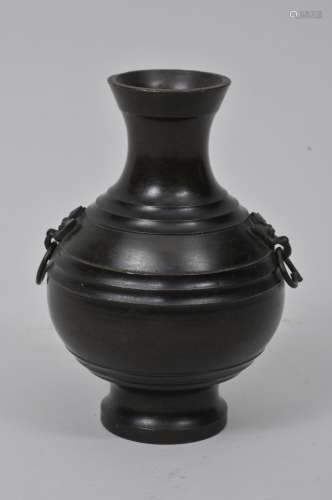 Bronze vase. China. 20th century. Archaic style Hu with bowstring marks and Tao Tieh jump rings. 5