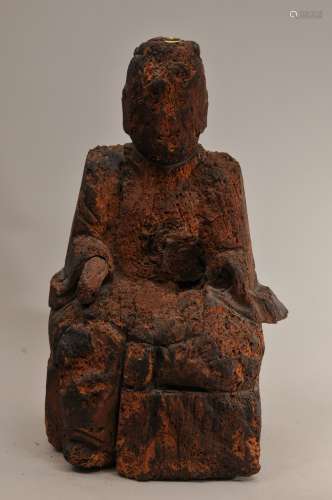 Carved wooden image of a Deity. China. 19th century or earlier. Heavily worn with considerable loss. 20