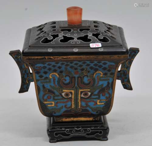 Cloisonné Censer. China. Ch'ien Lung mark (1735-1796) and of the period. Flaring square form with handles. Decoration Tao Tieh masks and floral scrolling. Fitted hardwood stand and cover inlaid with silver carnelian finial. 6