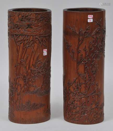 Lot of two bamboo brush pots. Relief carving of bamboo and flowering prunus. China. 19th century. One with age lines. 11-3/4
