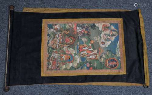 Buddhist painting. Tibet. 18th century. Thangkha of The Great Adept Upsaka Dharmatala surrounded by trantric divinities, each labeled in gold. Mineral pigments and gilt on heavy cloth. 24