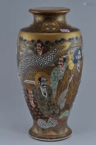 Pottery vase. Japan. Meiji period. (1868-1912). Decoration of dragon and the Hundred Rakan. Signed. 7-1/2