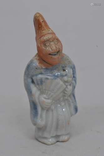 Porcelain Netsuke. Japan. 19th century. Herado ware. Monkey in court costume with a moveable head. 2-1/2