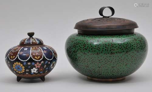 Lot of two Cloisonné censers. Japan. Early 20th century. To include: A green and black censer and one with floral decoration. Largest 6