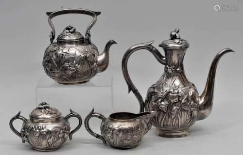 Japanese Sterling silver. Four pieces. Tea and coffee set. Repousse decoration of iris flowers. Signed.  55.2 ozt.