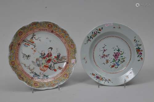 Two porcelain plates. Chinese Export ware. Decoration of flowers and people. Famille Rose enamels. One possibly Samson.  9-1/2