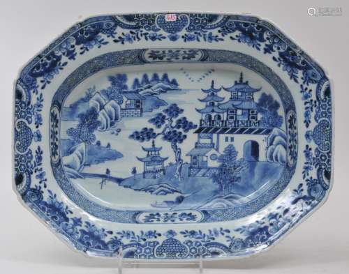 Chinese Export platter. Circa 1800. Octagonal shape. Underglaze blue decoration of pavilions in a landscape. Floral and brocade borders. 15