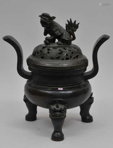 Bronze censer. China. Ming period. (1368-1644). Foo dog finial, animal head feet, heaven soaring handles. Lid with pierced floral decoration. 14