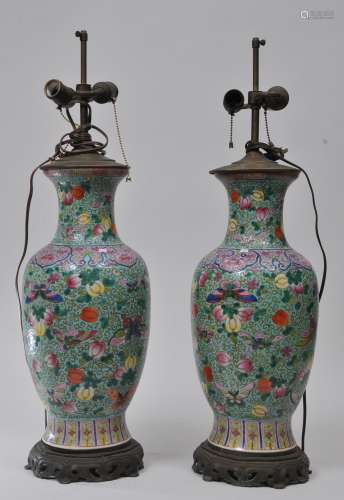 Pair of porcelain vases. China. 19th century. Famille Rose decoration of melons and butterflies on a turquoise ground. Drilled and mounted as a lamp. 19