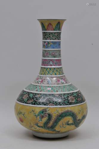 Porcelain vase. China. 19th century. Decoration of various coloured bands decorated with brocade patterns, fruit, flowers, bats and dragons. Dragons and pearls in green on a yellow ground. 16-1/2