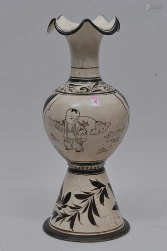 Stoneware vase. China. Liao period. 13th century. Tzu Chou ware. Brown decoration of children playing and flowers on a cream coloured ground. 14-1/4