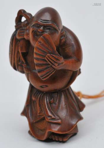 Wood Netsuke. Japan. 19th century. Hoi Tei with a fan. 1-3/4